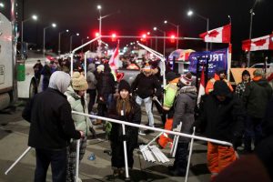 Read more about the article Protesters defy injunction order, continue to occupy key U.S.-Canada bridge By Reuters
